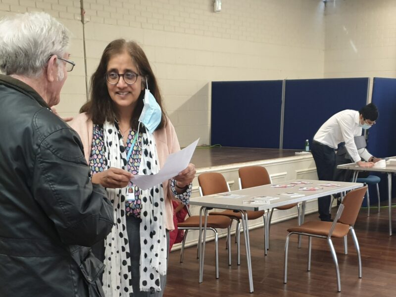 Two people talking at an events venue in Sutton